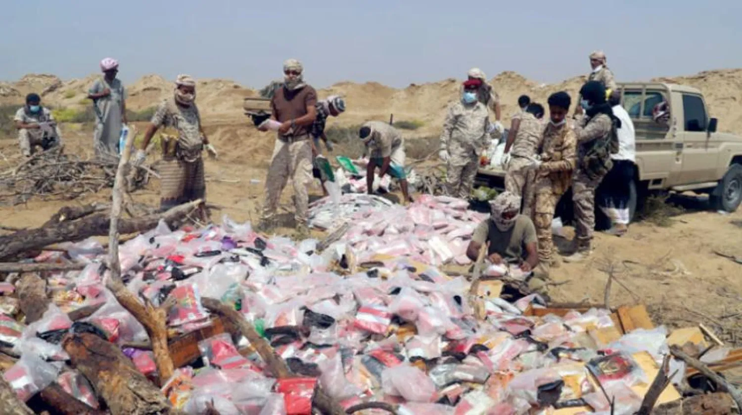 Authorities destroy the seized drugs in Hajjah. (Asharq Al-Awsat)