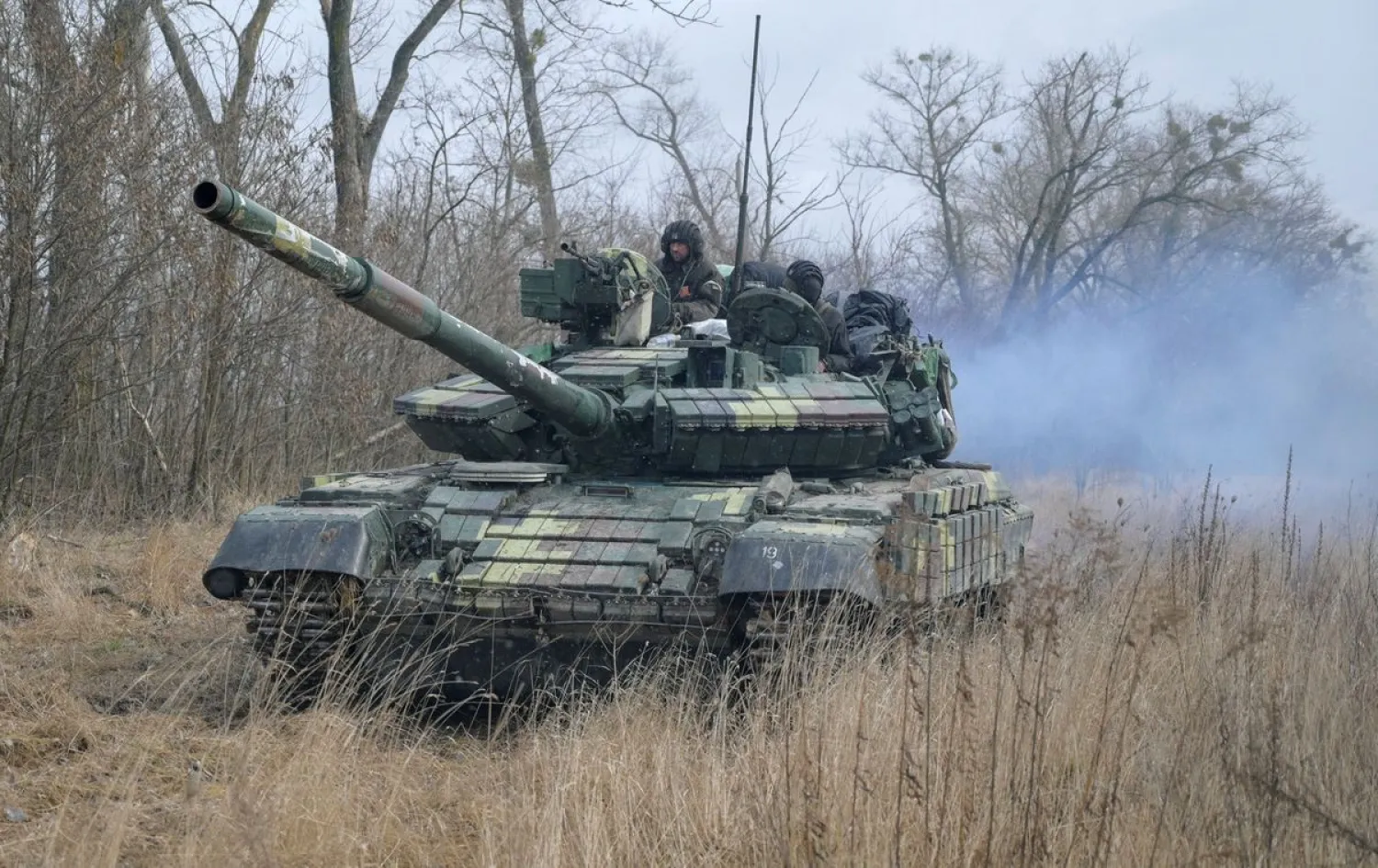 Service members of the Ukrainian armed forces are seen atop of a tank at their positions outside the settlement of Makariv, amid the Russian invasion of Ukraine, near Zhytomyr, Ukraine March 4, 2022. (Reuters)