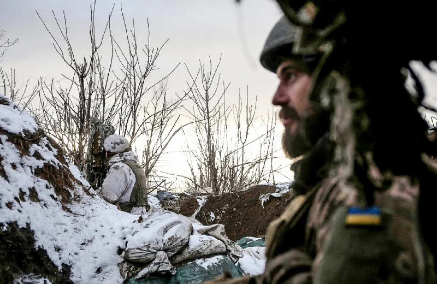 Ukrainian soldiers stand in position on the front line with Russia-backed separatists in Donetsk Oblast in February, 2021. Photo: AFP
