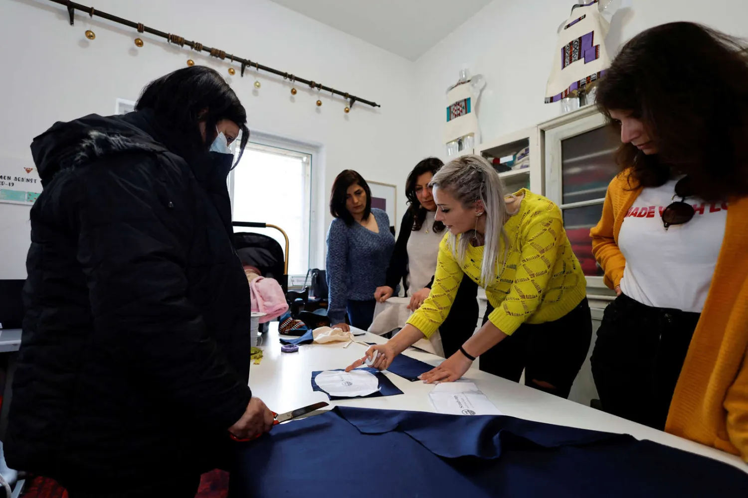  Palestinian fashion designer Nadya Hazboun gives instructions
to trainees in Bethlehem, in the Israeli-occupied West Bank. Reuters
