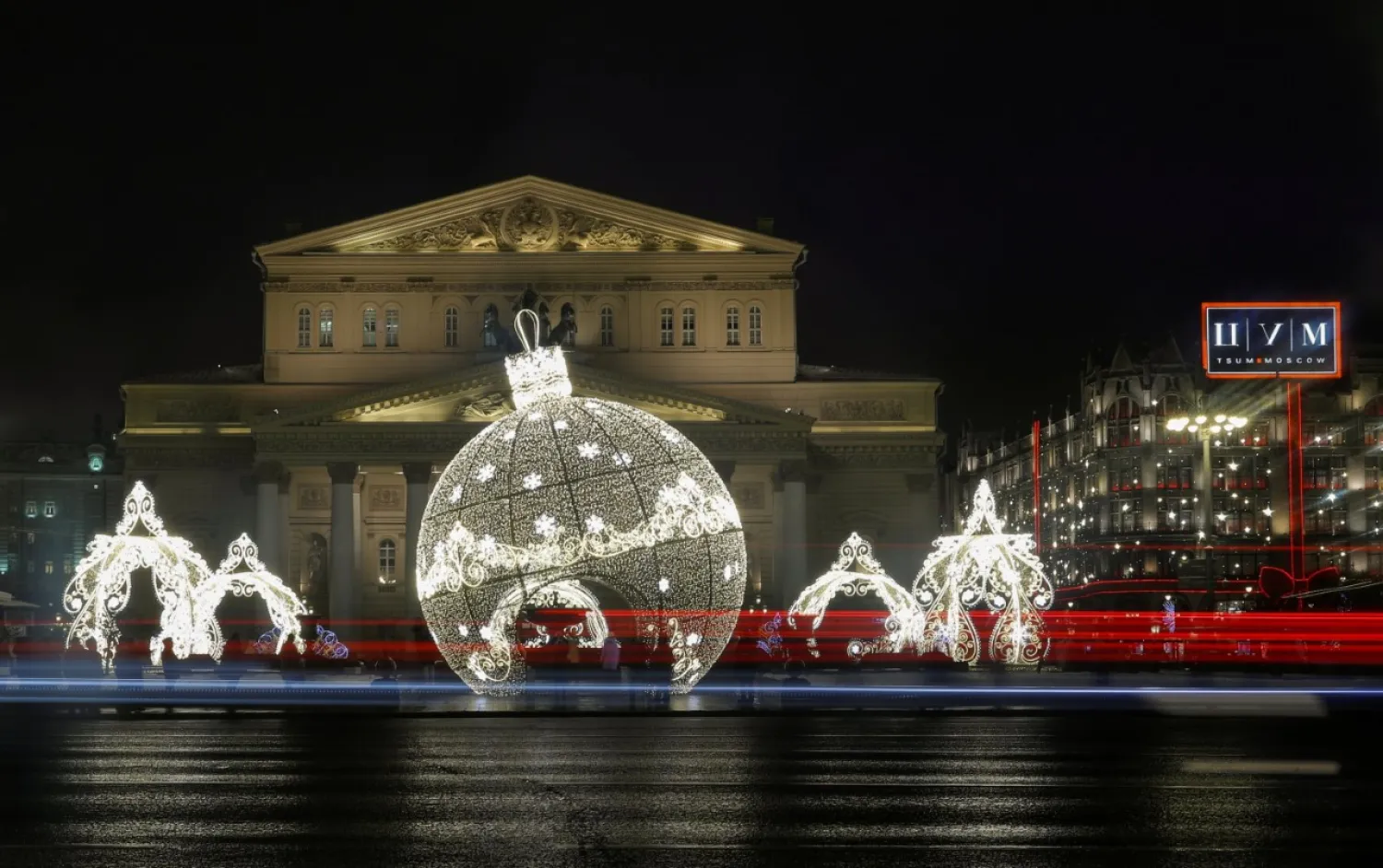 Traffic flows past the New Year and Christmas season decorations in front of the Bolshoi Theater in Moscow, Russia, Dec. 16, 2020. (Reuters Photo)

