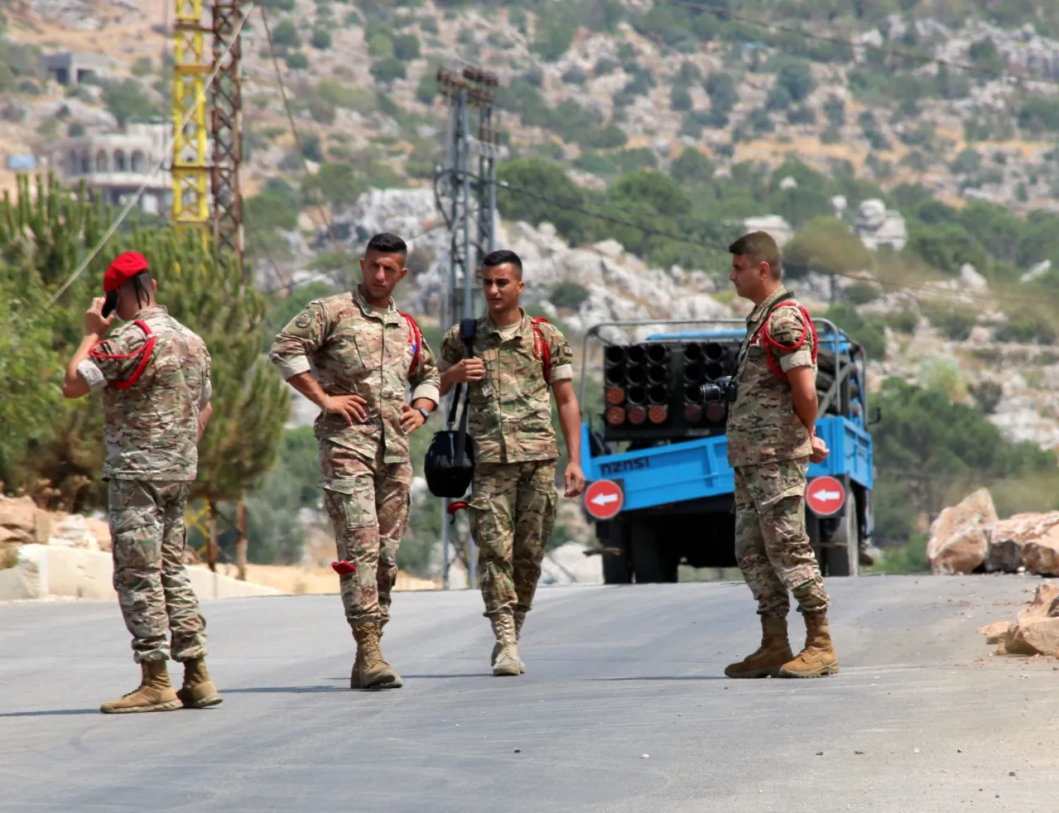 Lebanese army members stand near a pickup truck with a rocket launcher in Chouaya, Lebanon, August 6, 2021. REUTERS/Karamallah Daher

