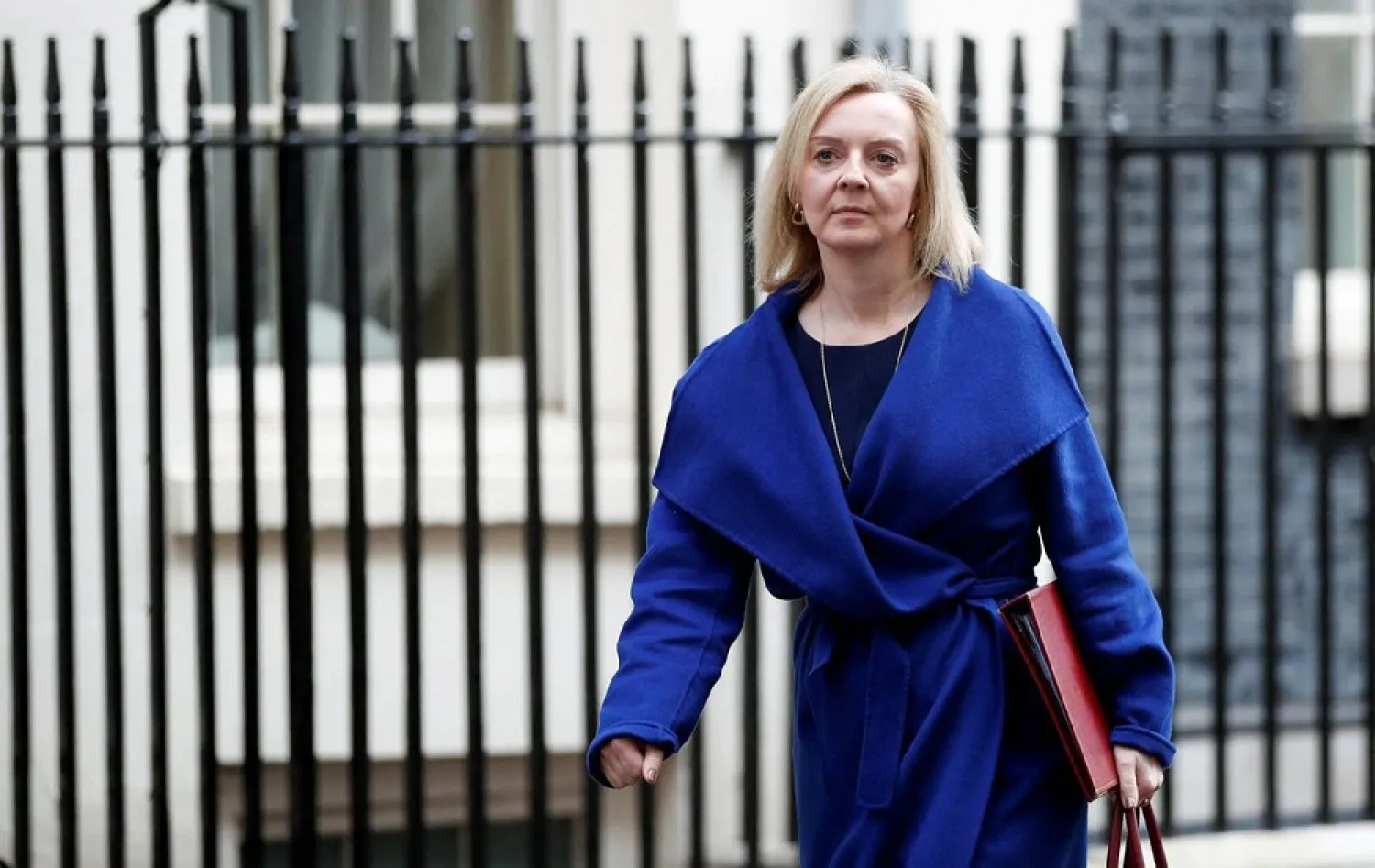 British Foreign Secretary Liz Truss walks outside Downing Street in London, Britain March 8, 2022. (Reuters)