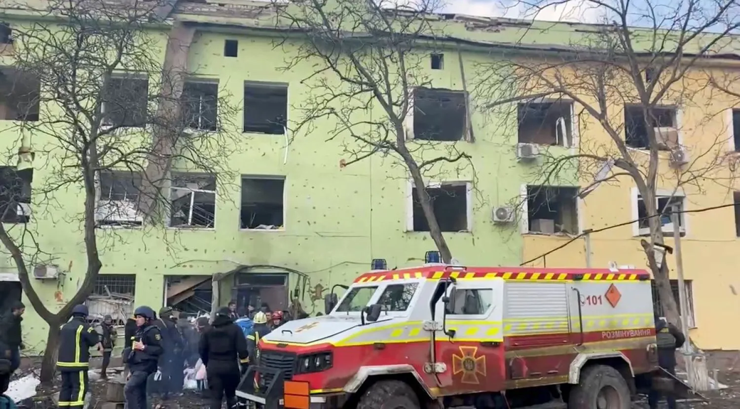 Emergency services are seen on site of the destroyed Mariupol children's hospital as Russia's invasion of Ukraine continues, in Mariupol, Ukraine, March 9, 2022 in this still image from a handout video obtained by Reuters. Ukraine Military/Handout via REUTERS

