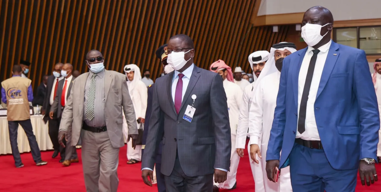 Chad's Prime Minister Albert Pahimi Padacke arrives at the start of peace talks in Doha on Sunday KARIM JAAFAR AFP
