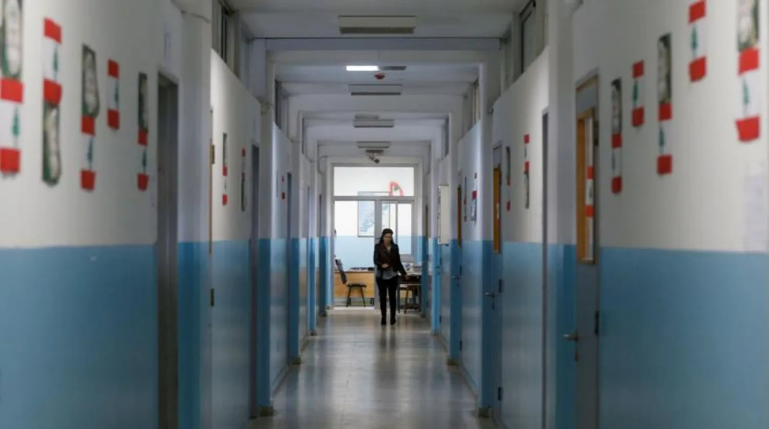 Caption: A teacher walks along a corridor of a public school in Beirut, Lebanon. (File photo: Reuters)
