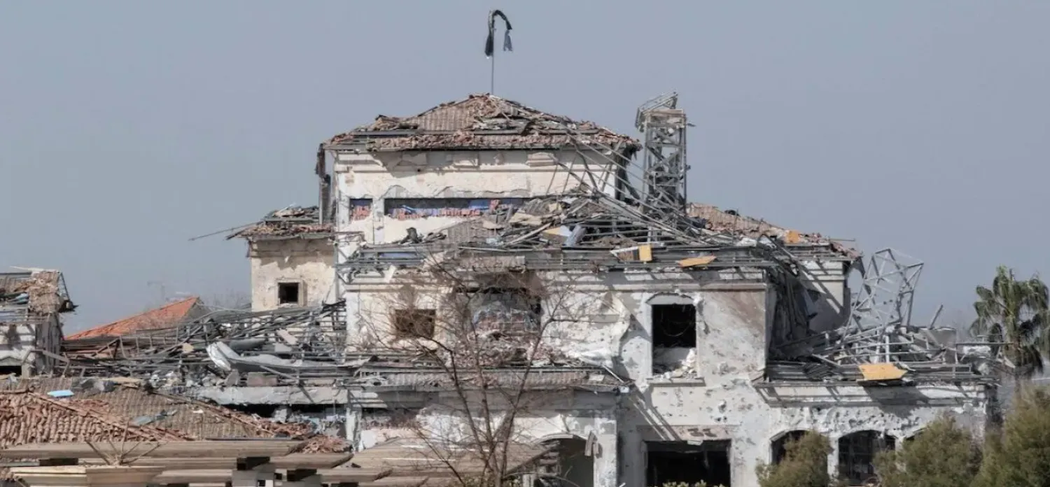 A picture taken on March 13, 2022, shows a view of a damaged building after an overnight attack in Arbil, the capital of the northern Iraqi Kurdish autonomous region. [SAFIN HAMED/AFP via Getty Images]