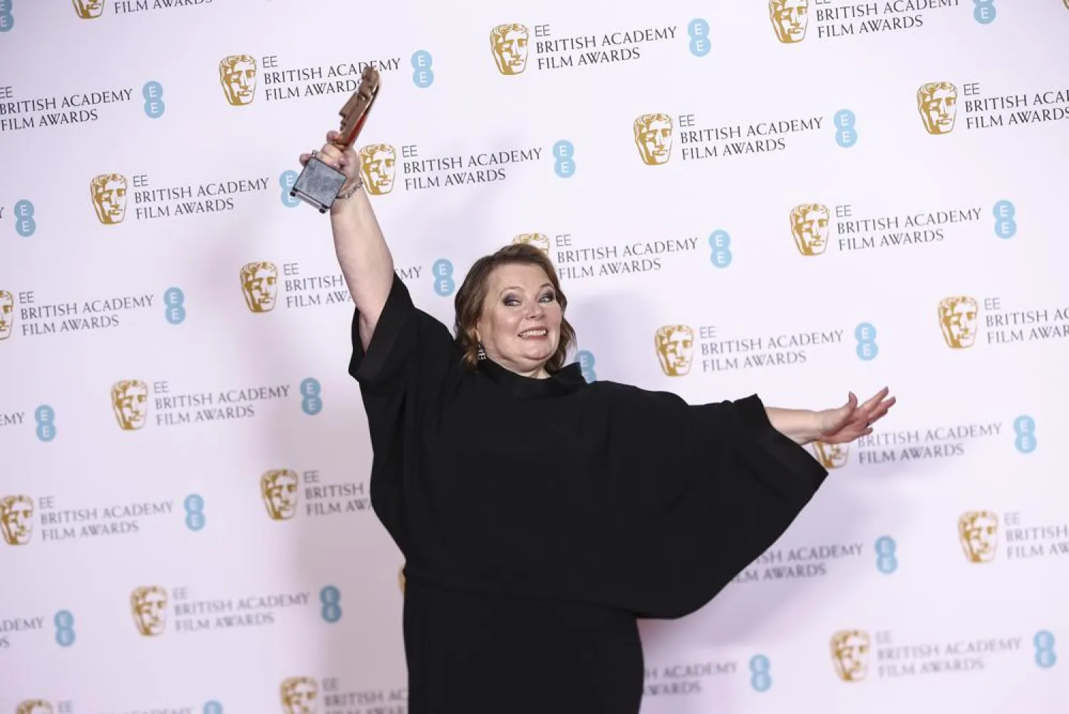 Joanna Scanlan holds her Best Actress award for her role in the film 'After Love' at the 75th British Academy Film Awards, BAFTA's, in London Sunday, March 13, 2022. (AP)