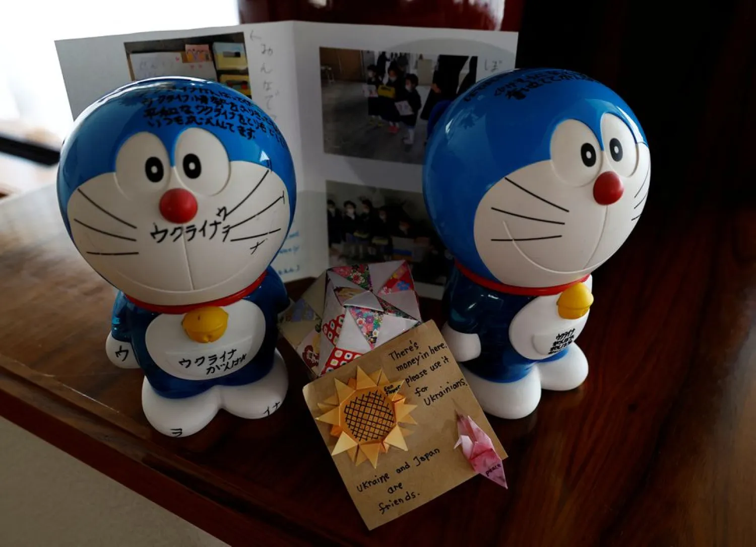 Money boxes donated from a Japanese family to support Ukraine are displayed at a room of Ukraine's embassy in Tokyo, Japan March 11, 2022. (Reuters)
