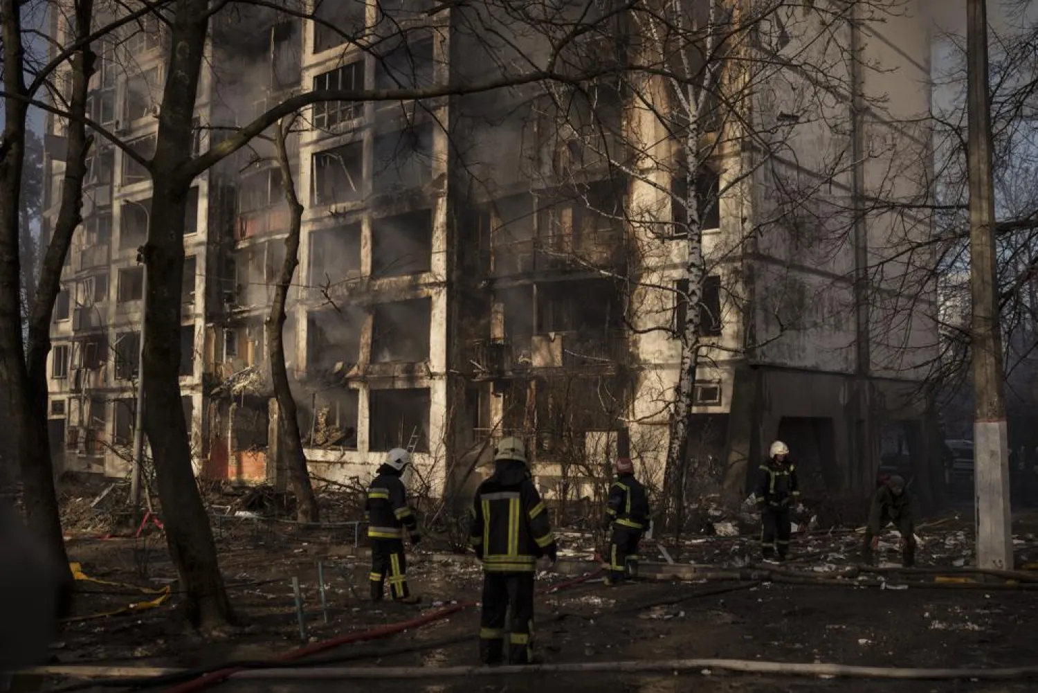 Firefighters work at the scene of an apartment building bombing in Kyiv, Ukraine, Tuesday, March 15, 2022. (AP)