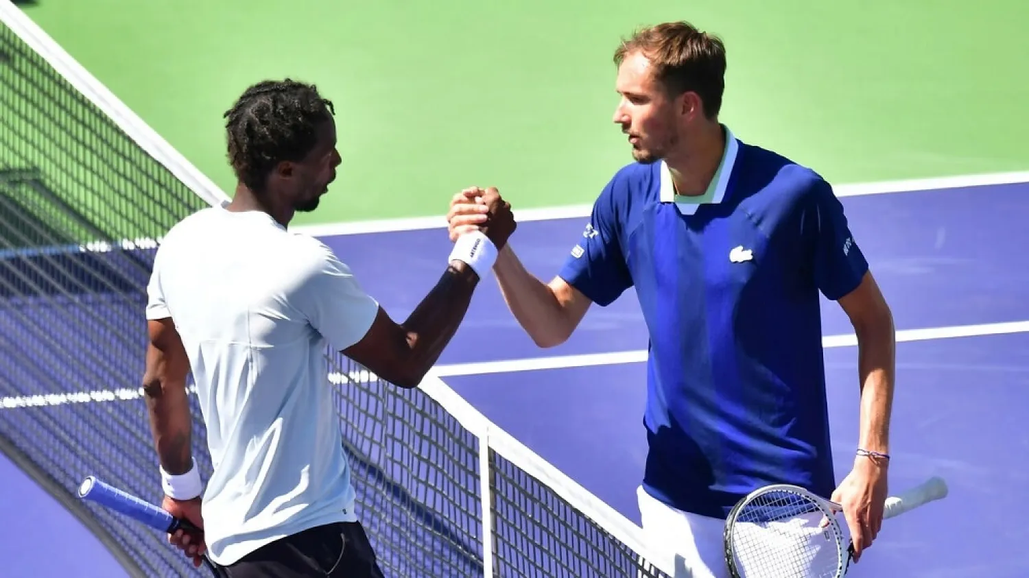 Russia's Daniil Medvedev (right) congratulates Gael Monfils after crashing out of the Indian Wells Masters on Monday. (AFP)