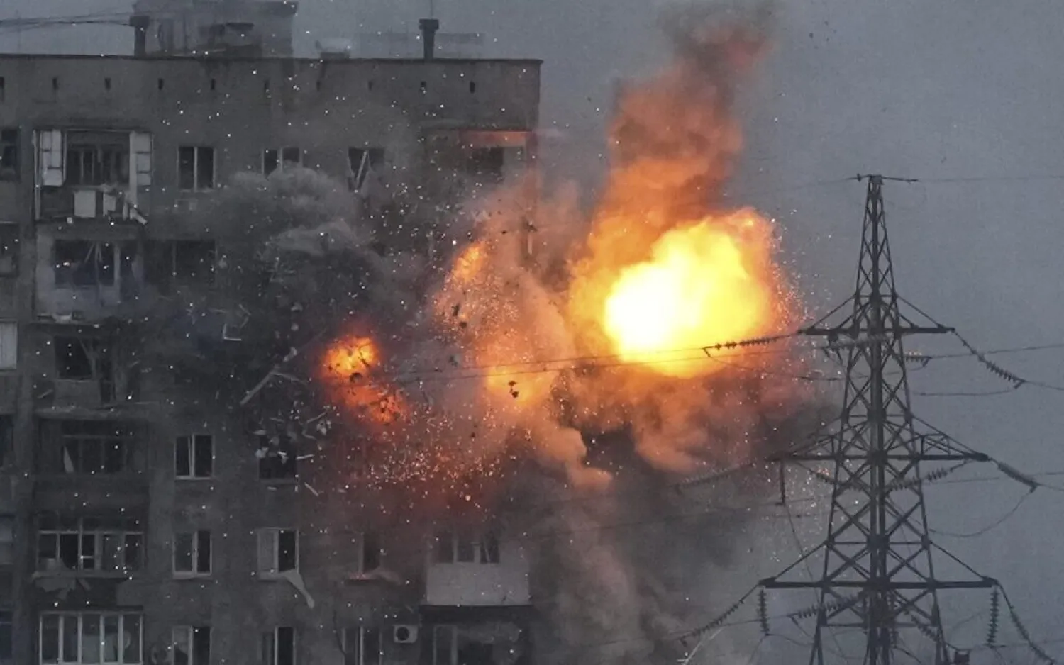 An explosion in an apartment building that came under fire from a Russian army tank in Mariupol, Ukraine, on Friday, March 11, 2022. (AP Photo/Evgeniy Maloletka)

