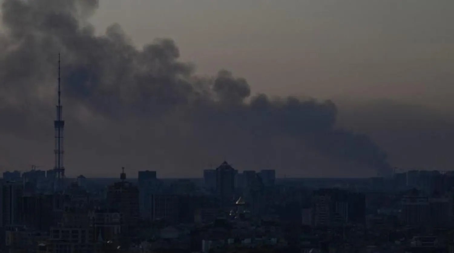 This general view taken in Kyiv on March 19, 2022 shows smoke rising from the western outskirts of the city. (Photo by Aris Messinis / AFP)