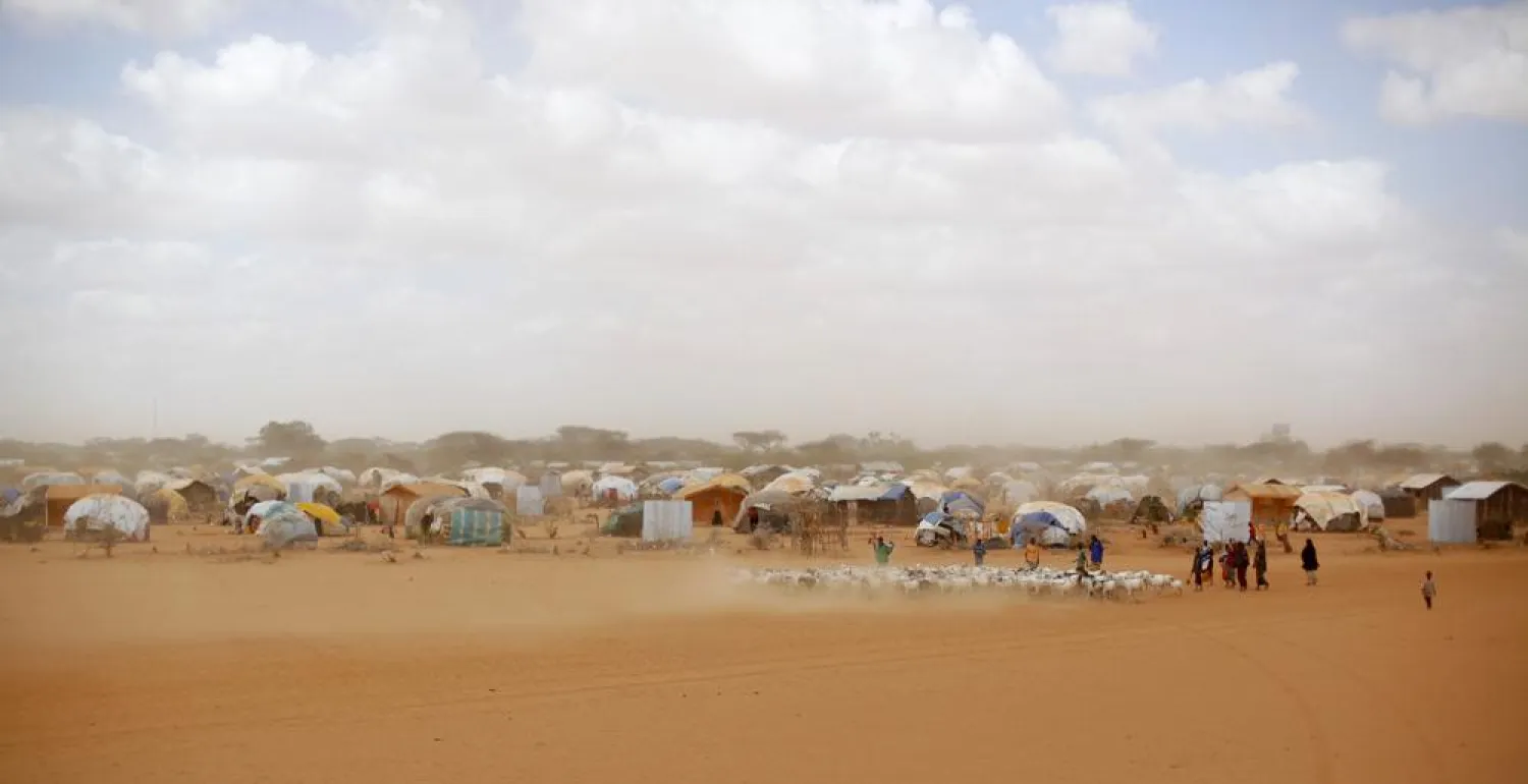 FILE - In this Aug. 7, 2011 file photo, Somali refugees herd their goats at the Ifo refugee camp outside Dadaab, eastern Kenya, 100 kilometers (62 miles) from the Somali border. Climate change could push more than 200 million people to move within their own countries in the next three decades and create migration hotspots unless urgent action is taken. (AP Photo/Jerome Delay, File)
