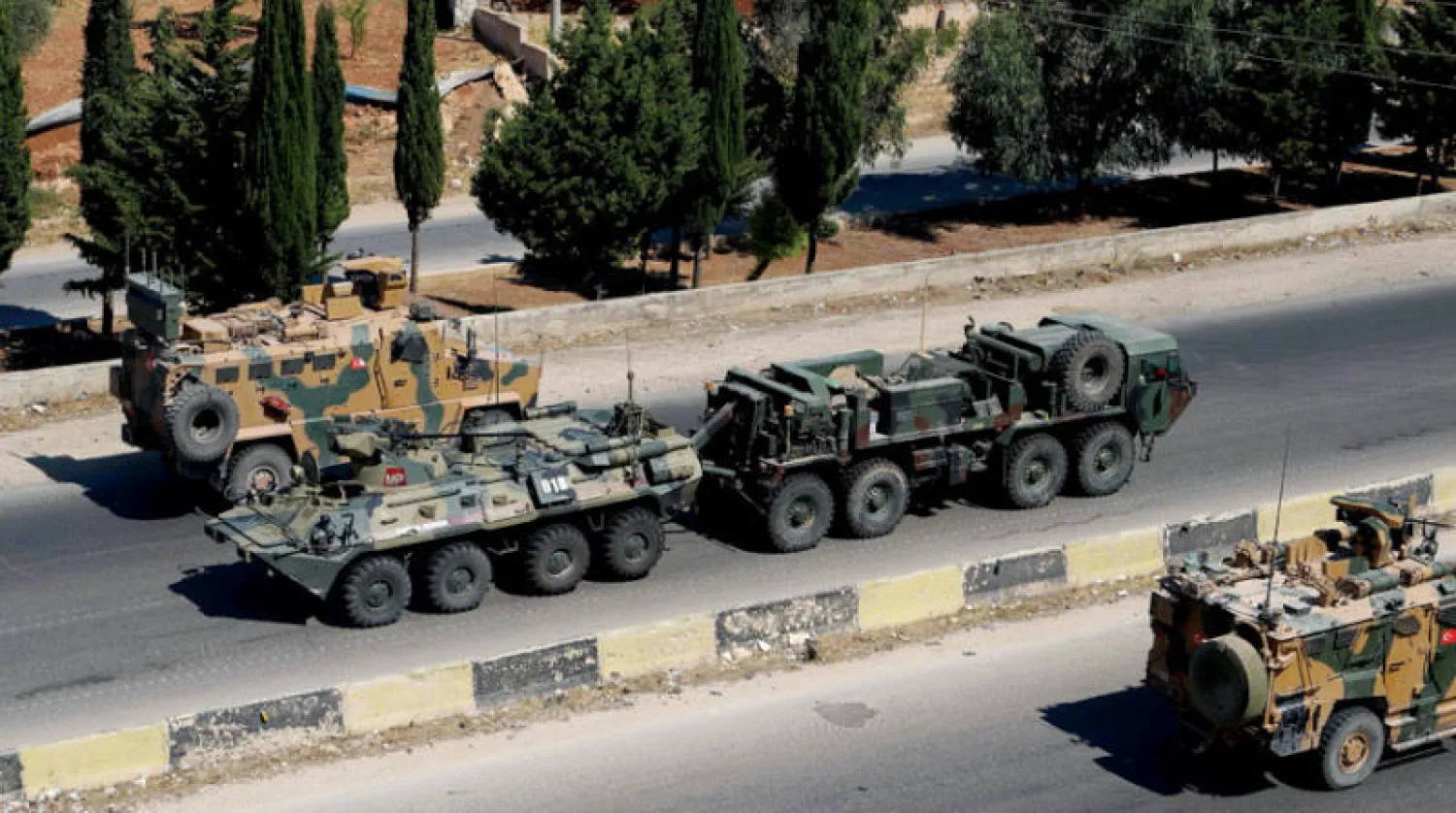 قافلة عسكرية تركية روسية مشتركة في إرم الجوز بإدلب عام 2020 (أ.ف.ب)