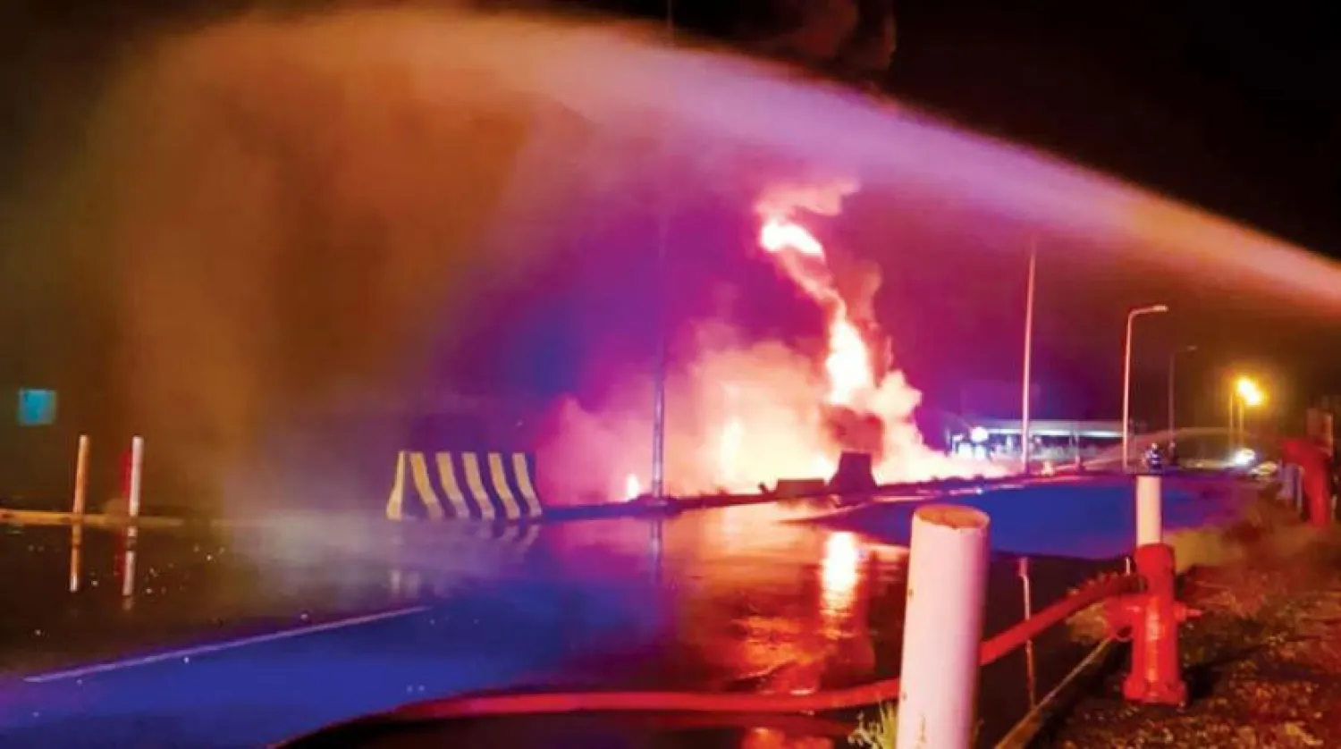 Fire is put out at a petroleum distribution plant in Jizan after Saudi defenses intercept a Houthi armed drone. (SPA)