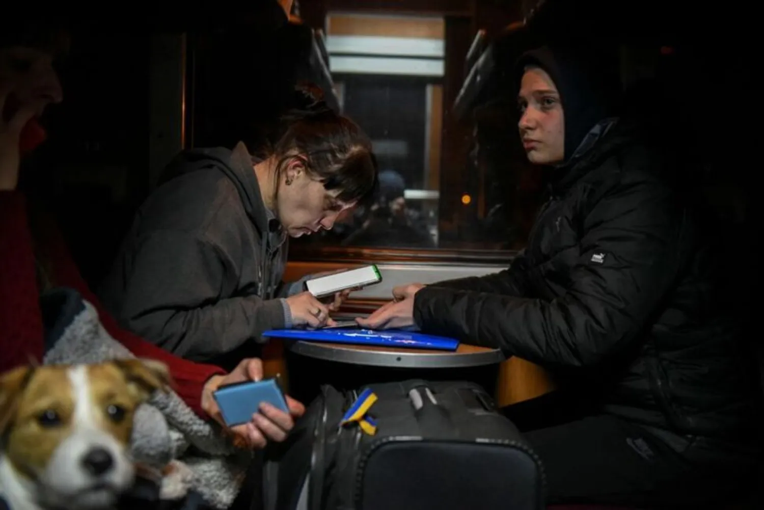Ludmila Lichko, 40, from Mykolaiv, and her son Vladislav, 16, travel on an evacuation train as they flee Russia’s invasion of Ukraine, on their way from Odessa to Ismail, Ukraine, March 16, 2022. (Reuters)