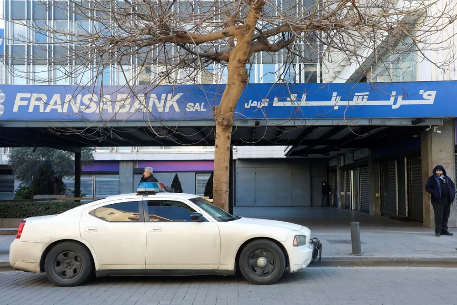 A police car is parked in front of a branch of Fransabank in Beirut, Lebanon March 16, 2022. (Reuters)