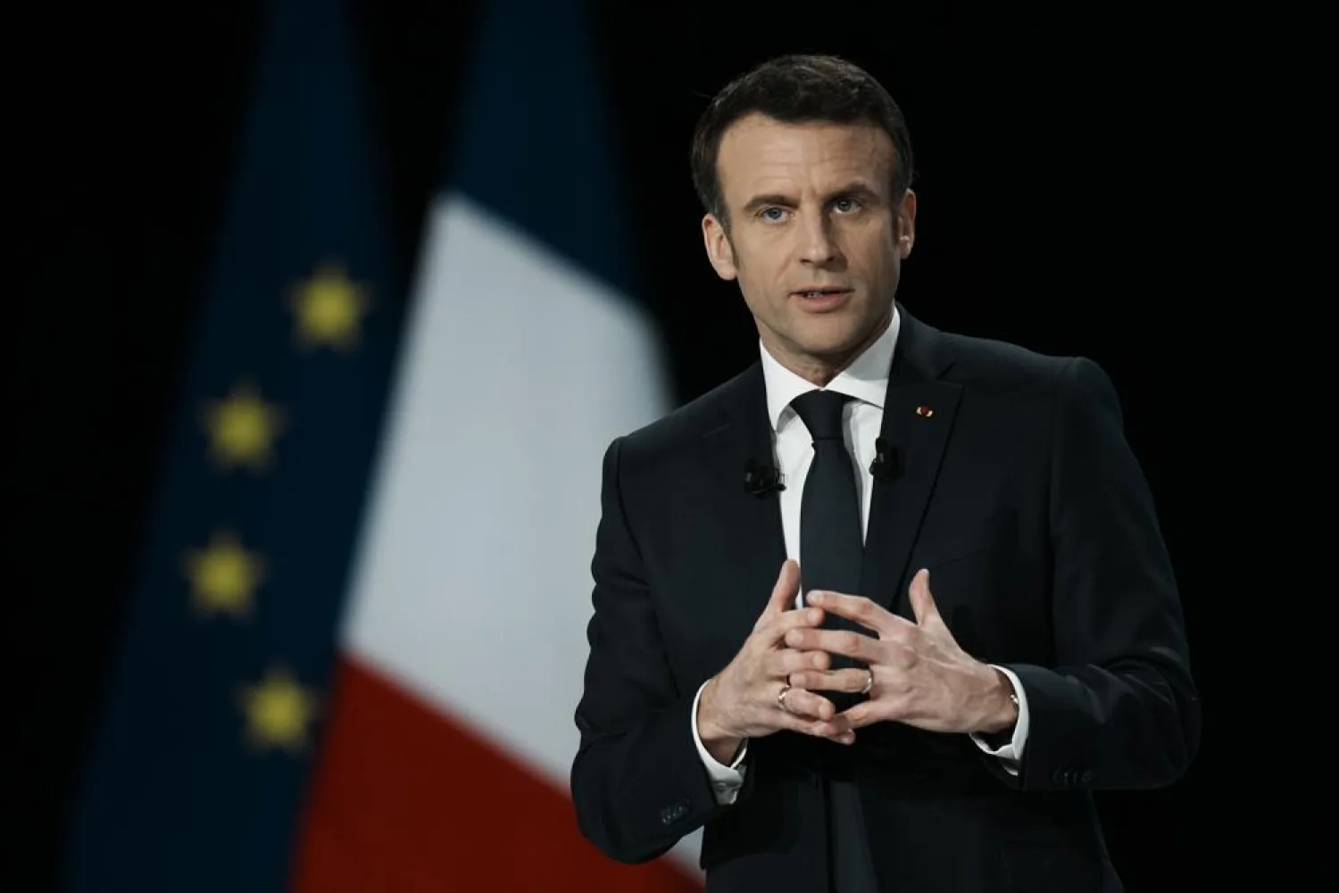 French President Emmanuel Macron delivers his speech during a presidential campaign news conference in Aubervilliers, north of Paris, France, Thursday, March 17, 2022. (AP)