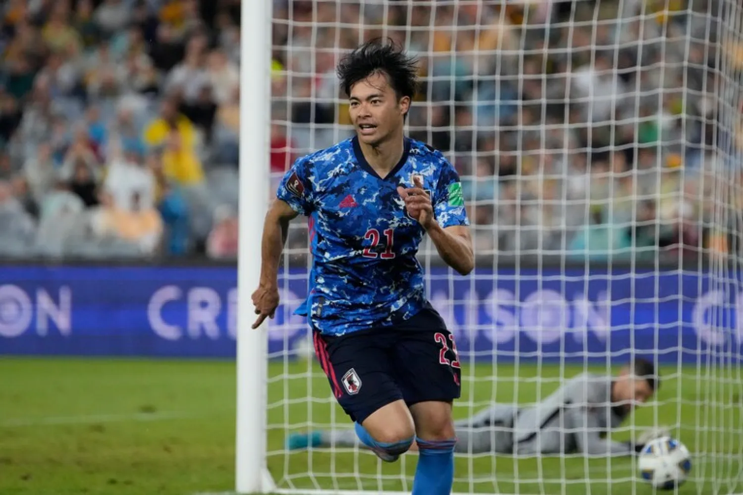 Japan’s Kaoru Mitoma celebrates after scoring a goal during the World Cup 2022 play-off soccer match between Japan and Australia at Stadium Australia in Sydney, Thursday, March 24, 2022. (AP Photo/Mark Baker)


