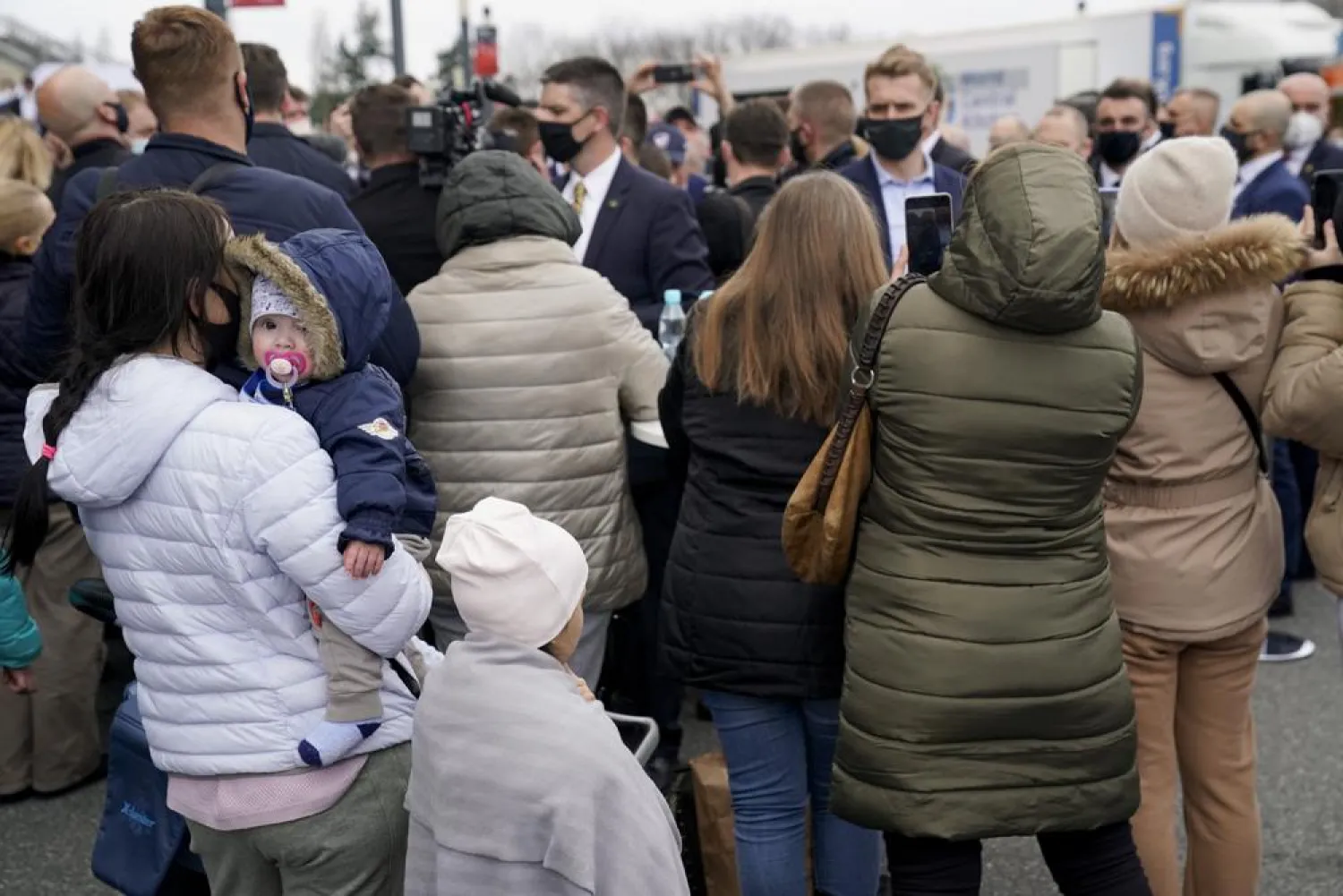Ukrainian refugees listen as President Joe Biden meets refugees and humanitarian aid workers during a visit to PGE Narodowy Stadium, Saturday, March 26, 2022, in Warsaw. (AP)