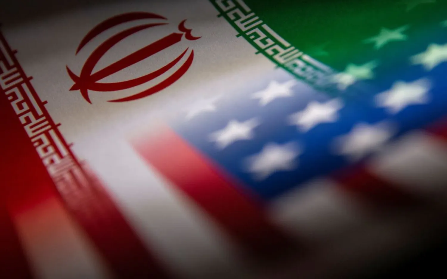 Iran's and US' flags are seen printed on paper in this illustration taken January 27, 2022. REUTERS/Dado Ruvic/Illustration

