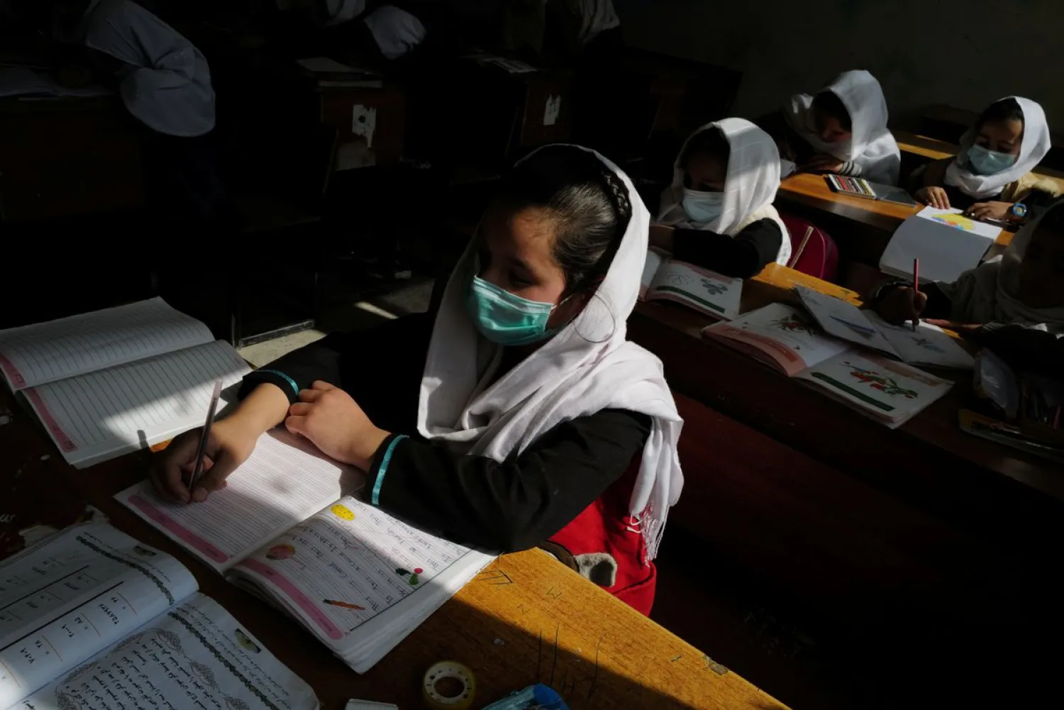 A 4th grade primary school student attends a class in Kabul, Afghanistan, October 25, 2021. (Reuters)