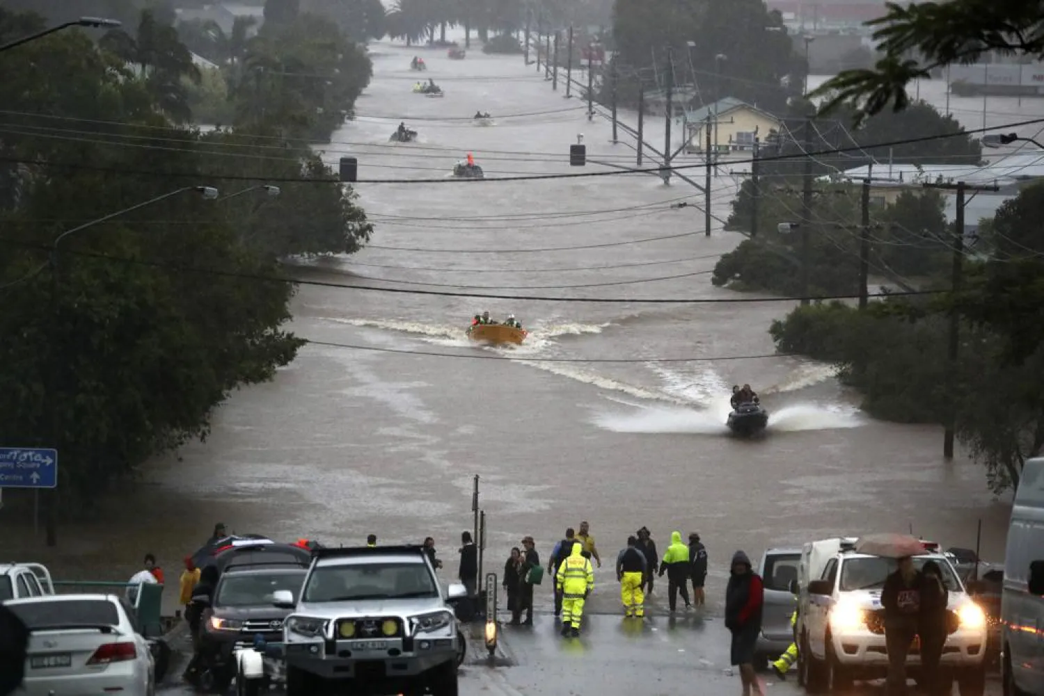 People use small boats to travel through flood water in Lismore, Australia, Monday, Feb. 28, 2022. (AP)