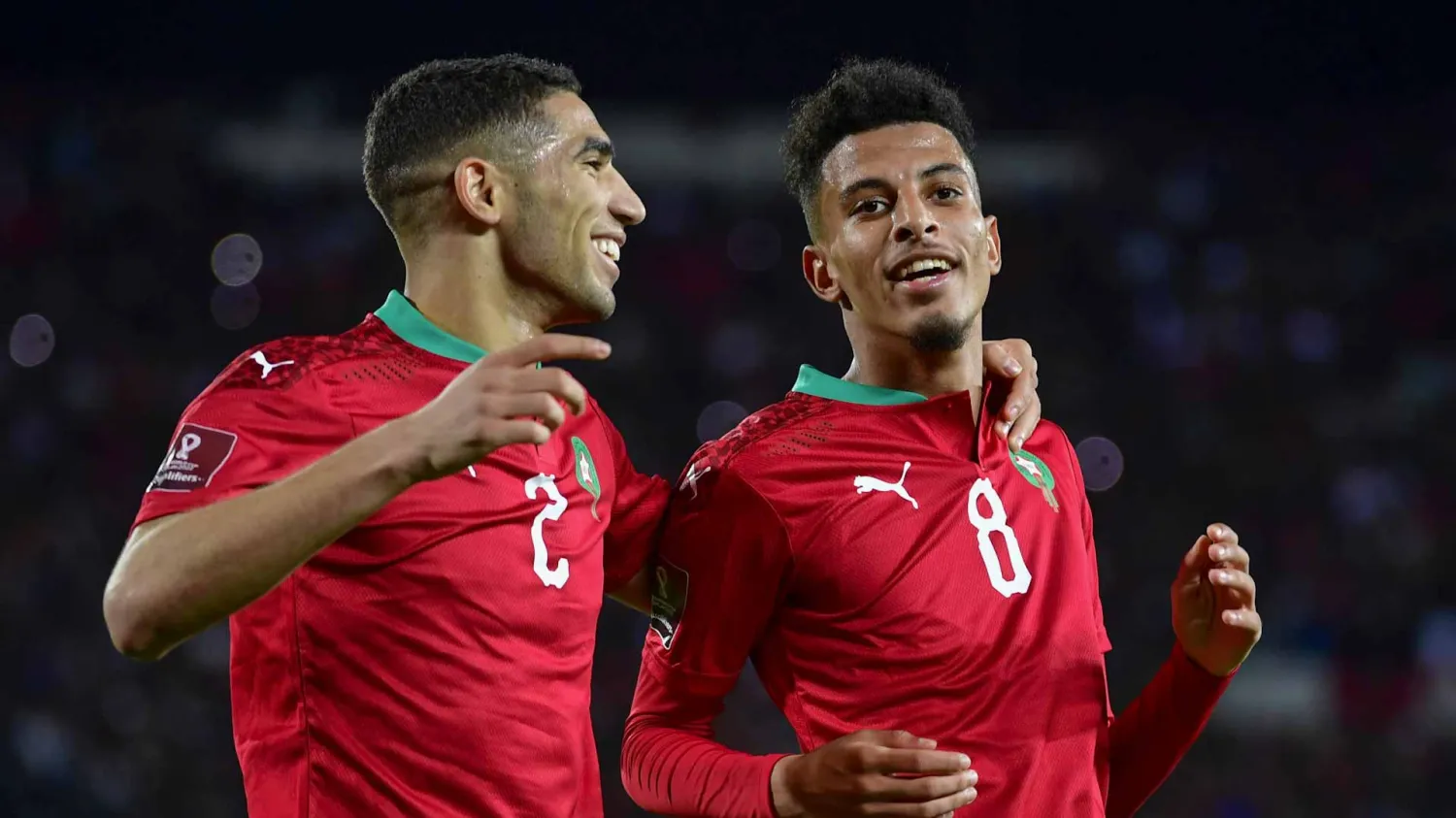 Morocco's forward Tarik Tissoudali (L) and Morocco's midfielder Azzedine Ounahi celebrate a goal during the second leg of the 2022 Qatar World Cup African Qualifiers football match between Morocco and DR Congo at the Mohamed V Stadium in the city of Casablanca on March 29, 2022. (Photo by AFP)