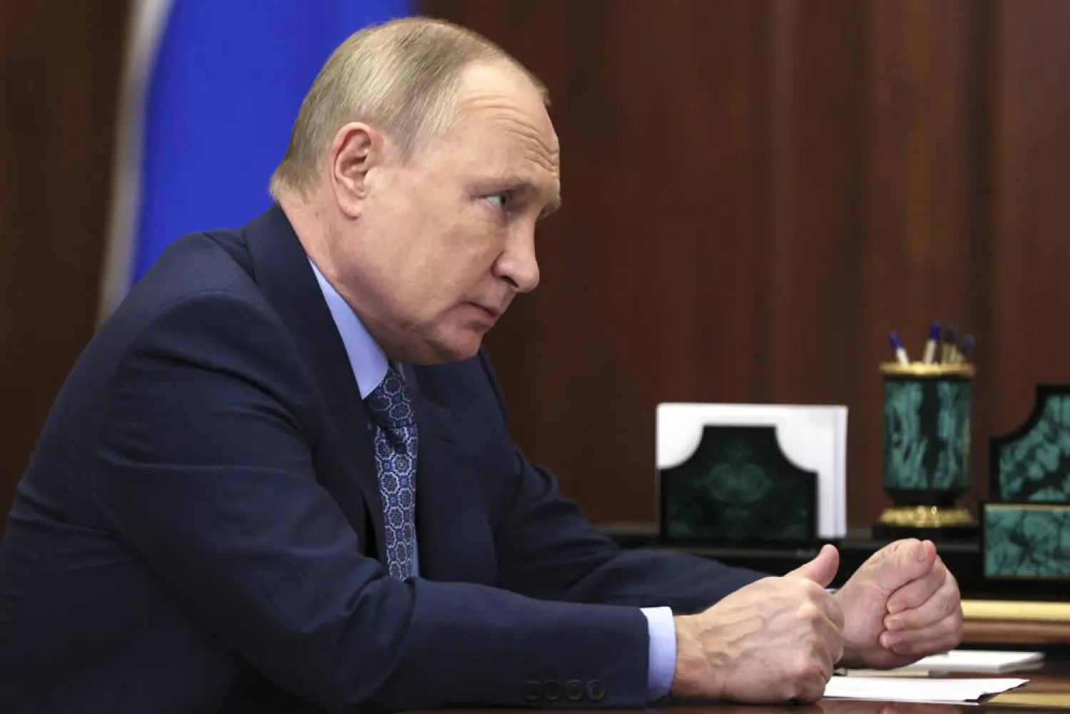 Russian President Vladimir Putin listens to Mahmud-Ali Kalimatov, the head of the Republic of Ingushetia during their meeting in Moscow, Russia, Wednesday, March 30, 2022. (Sputnik, Kremlin Pool Photo via AP)
