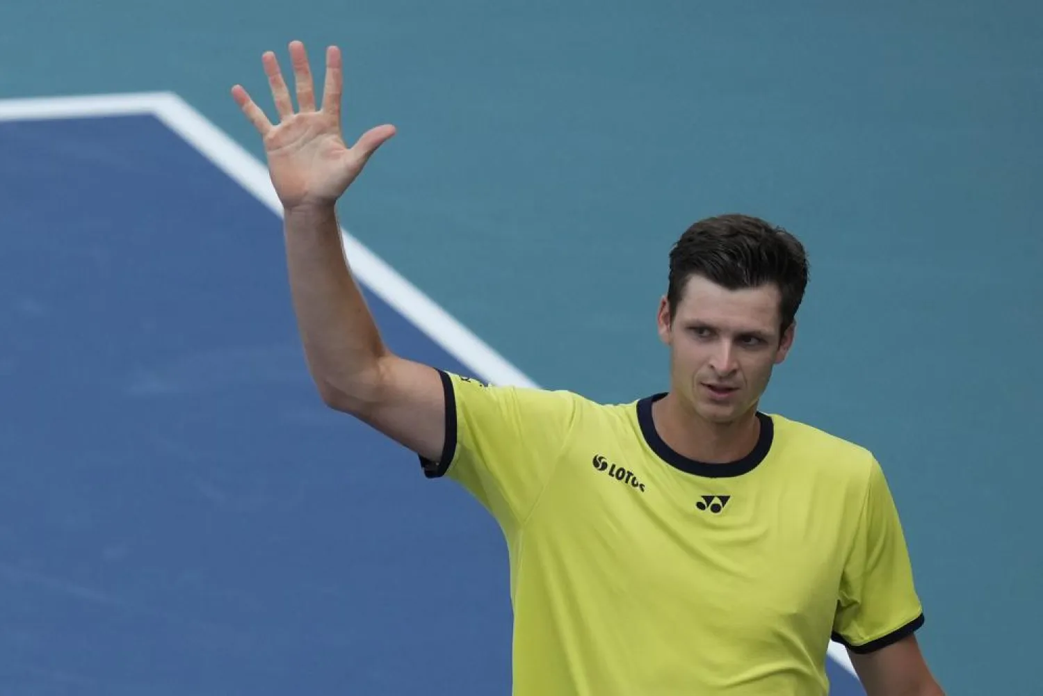 Hubert Hurkacz of Poland salutes fans after winning his men's quarterfinal match against Daniil Medvedev of Russia, at the Miami Open tennis tournament, Thursday, March 31, 2022, in Miami Gardens, Fla. (AP)