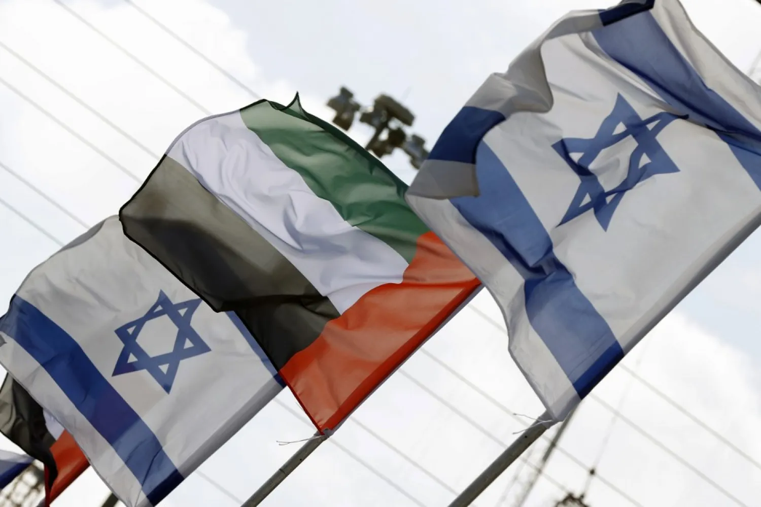 Israeli and United Arab Emirates flags line a road in the coastal city of Netanya on August 16, 2020. (AP)