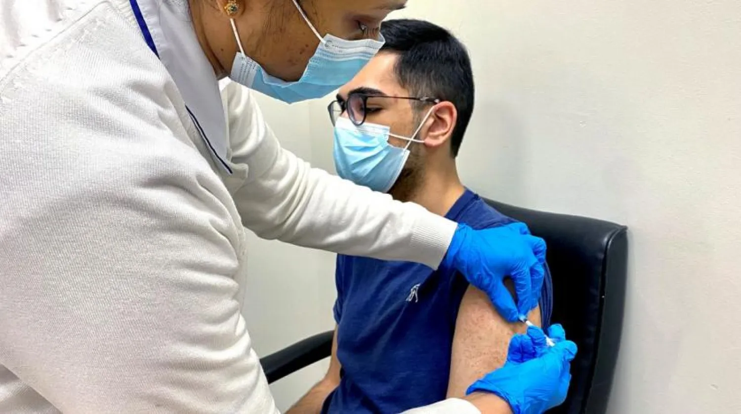 A man receives a dose of a vaccine against the coronavirus disease (COVID-19), in Dubai, United Arab Emirates December 28, 2020. REUTERS/Abdel Hadi Ramahi/File Photo
