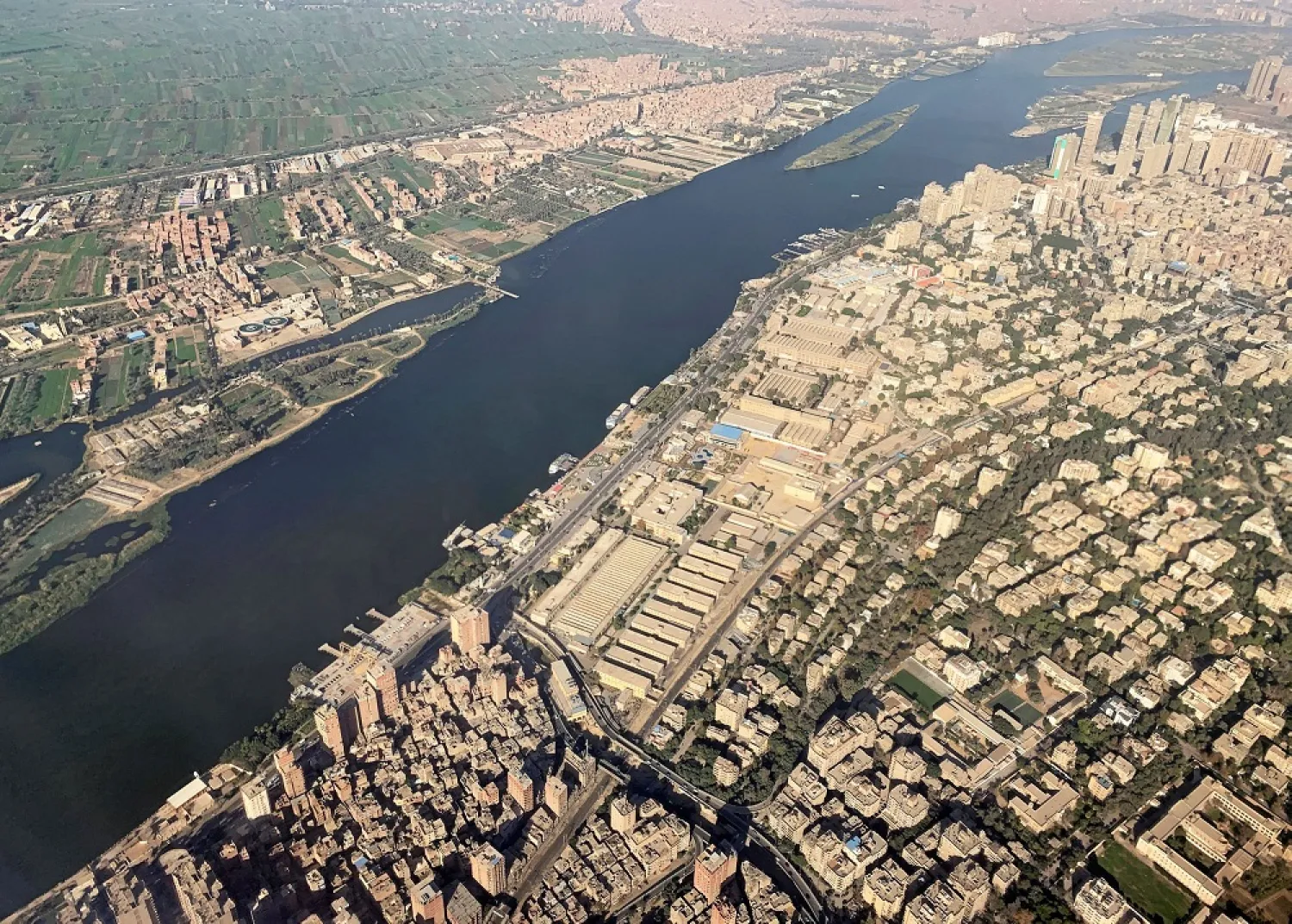 A view from an airplane window shows buildings around the Nile River in Cairo, Egypt March 10, 2020. (Reuters)