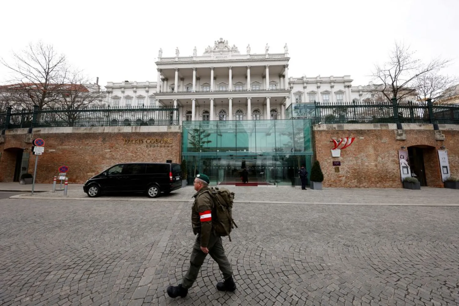 A member of Austrian armed forces walks past Palais Coburg, the site of a meeting of the Joint Comprehensive Plan of Action (JCPOA), in Vienna, Austria, February 8, 2022. (Reuters)