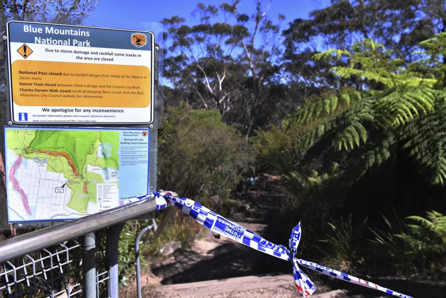 The entrance to the walking track where a landslide killed 2 and injured two others is tapped off at Wentworth Falls in the Blue Mountains, west of Sydney, Tuesday, April 5, 2022. (Dean Lewins/AAP Image via AP)
