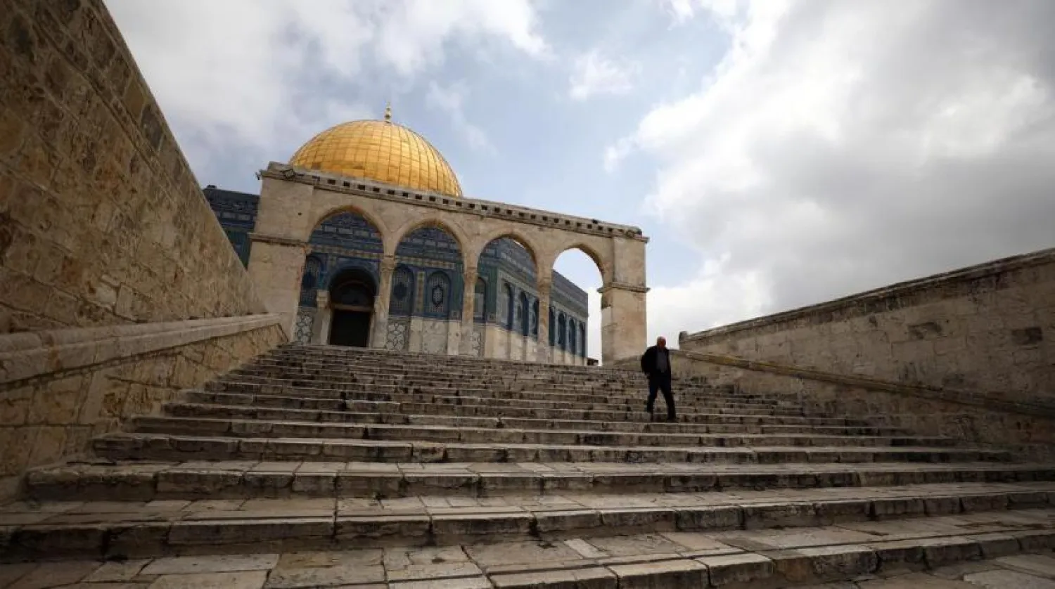  A man walks in front of the Dome of the Rock in the compound known to Muslims as Noble Sanctuary in Jerusalem's Old City on March 15, 2020. (Reuters)
