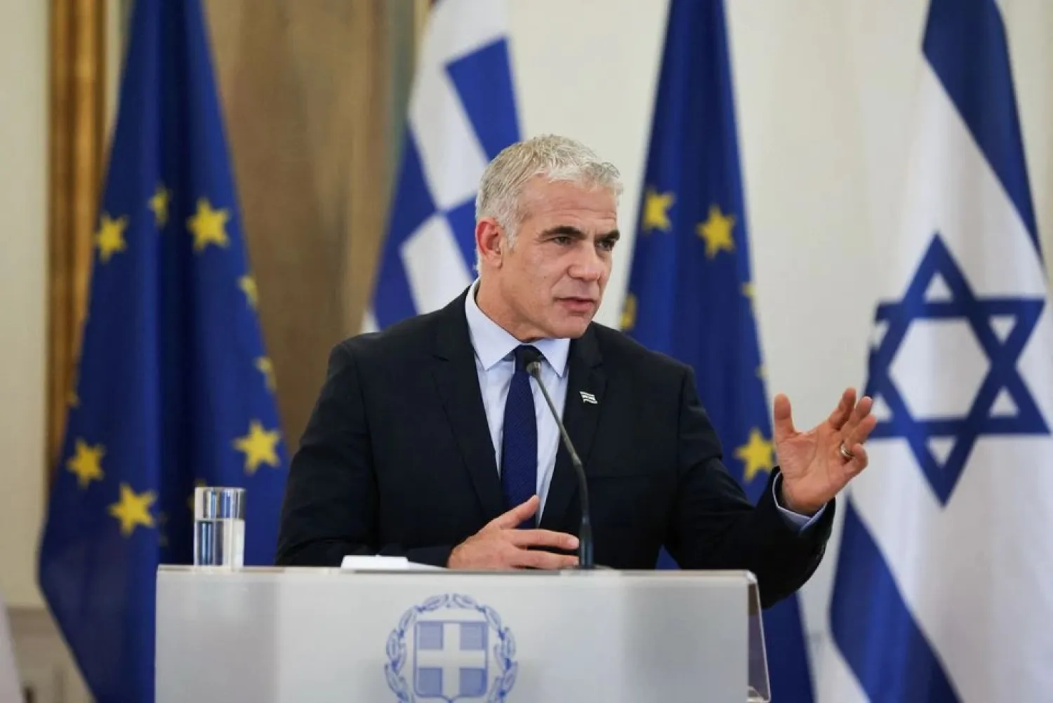 Israel's Foreign Minister Yair Lapid attends a news conference with Greek Foreign Minister Nikos Dendias and Cyprus's Minister of Foreign Affairs Ioannis Kasoulidis following a meeting at the Ministry of Foreign Affairs in Athens, Greece, April 5, 2022. (Reuters)