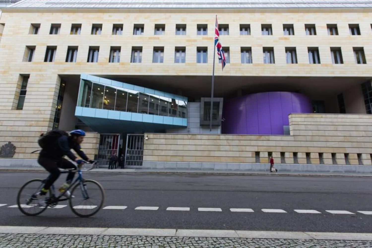 A man cycles past the British Embassy in Berlin November 5, 2013. (Reuters)