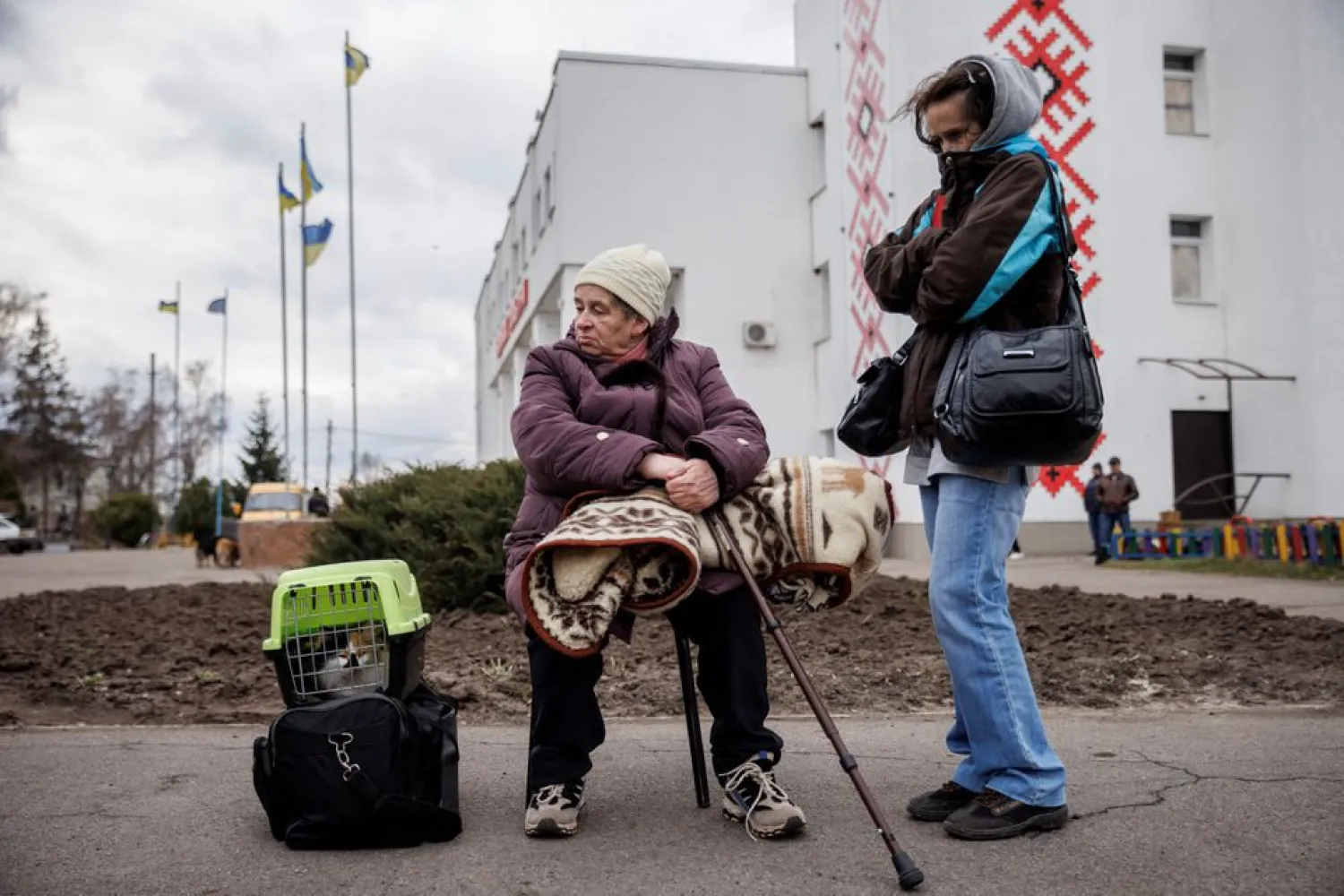 People wait to be evacuated from the heavily shelled town of Derhachi outside Kharkiv, as Russia's attack on Ukraine continues, in Ukraine, April 6, 2022. (Reuters)
