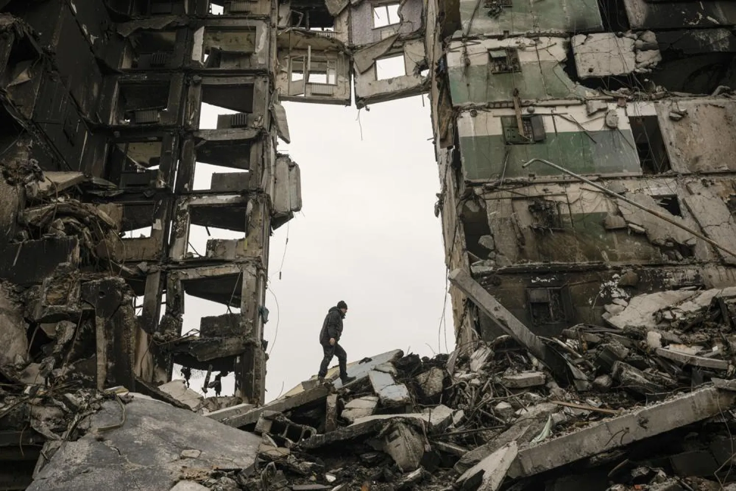 A resident looks for belongings in an apartment building destroyed during fighting between Ukrainian and Russian forces in Borodyanka, Ukraine, Tuesday, April 5, 2022. (AP)