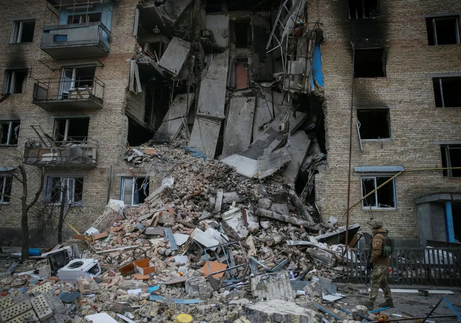A Ukrainian service member walks on the front line near Kyiv as Russia's invasion of Ukraine continues, Ukraine March 29, 2022. REUTERS/Gleb Garanich
