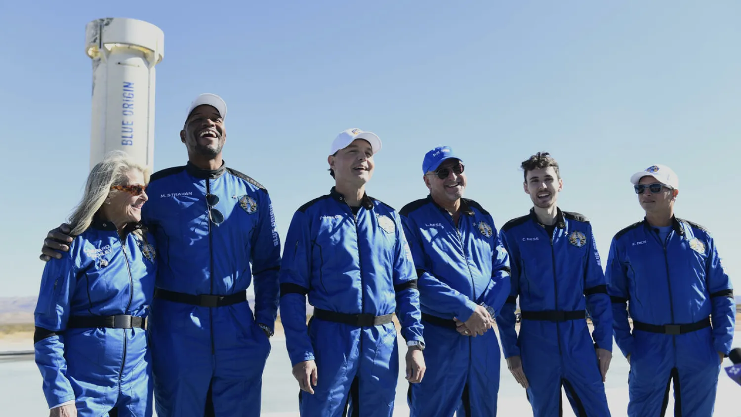 The Blue Origin NS-19 crew stand next to the New Shepard rocket after their successful launch on December 11, 2021 Patrick T. FALLON AFP/File
