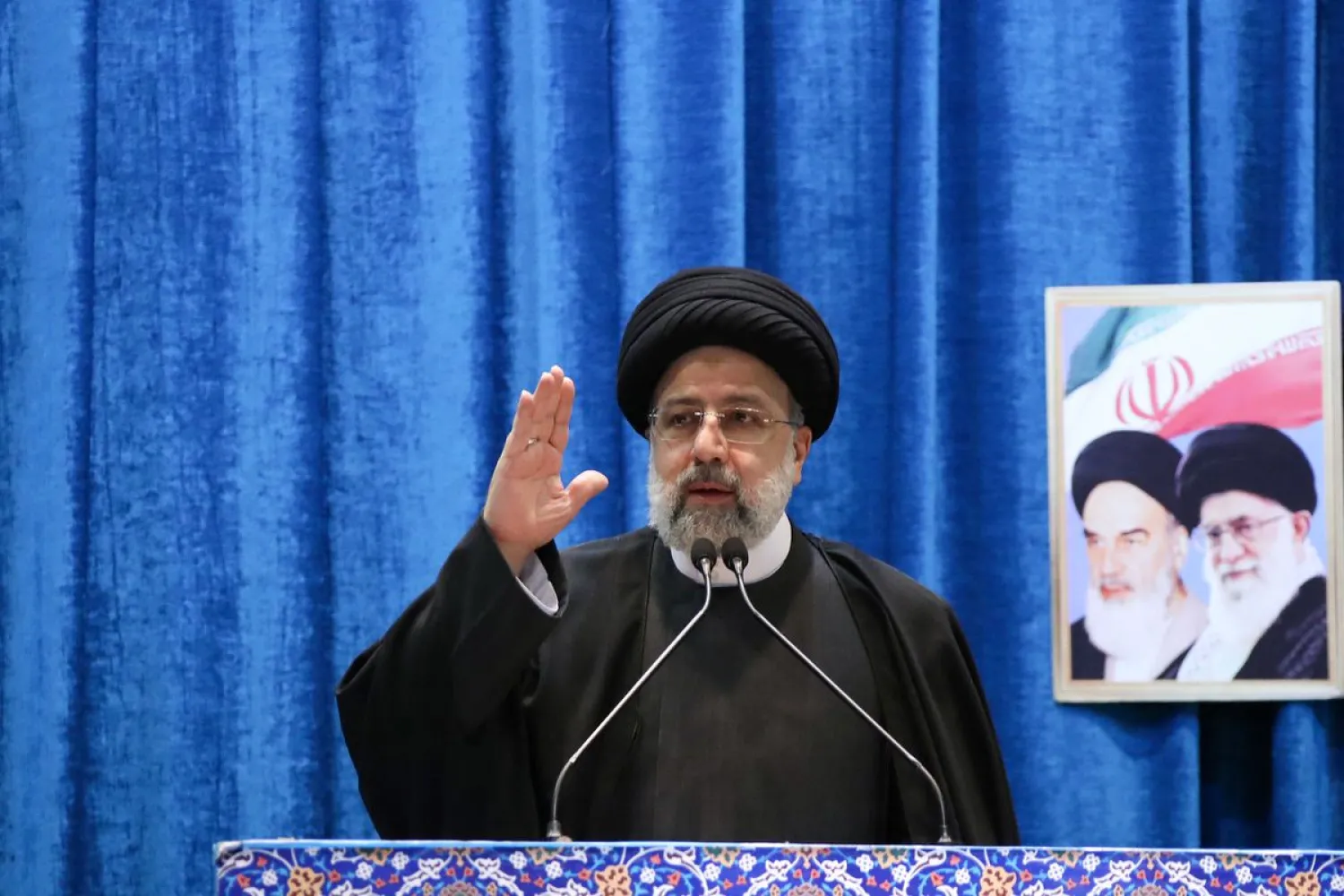 Iranian President Ebrahim Raisi gestures as he speaks at Tehran's Friday prayer on the occasion of the 43rd anniversary of the country's revolution of Iran in Tehran, Iran, February 11, 2022. (West Asia News Agency/Handout via Reuters)
