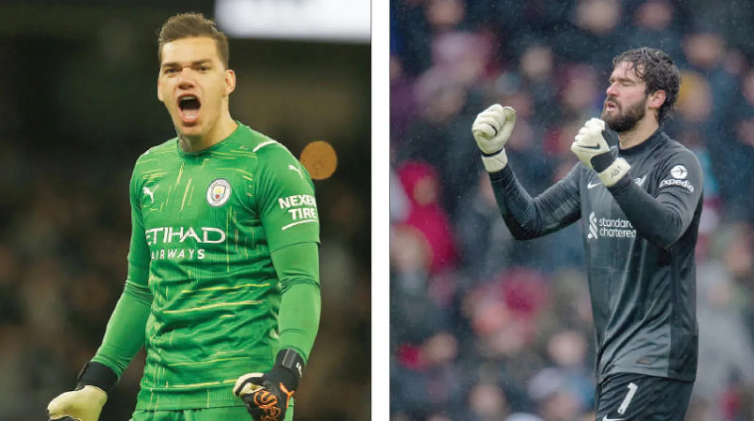 أليسون حارس ليفربول (إ.ب.أ) - إيدرسون حارس مانشستر سيتي (رويترز)