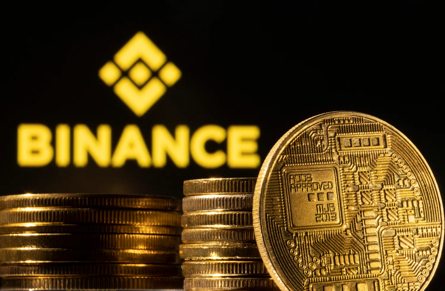 A representation of the cryptocurrency is seen in front of Binance logo in this illustration taken, March 4, 2022. REUTERS/Dado Ruvic/Illustration

