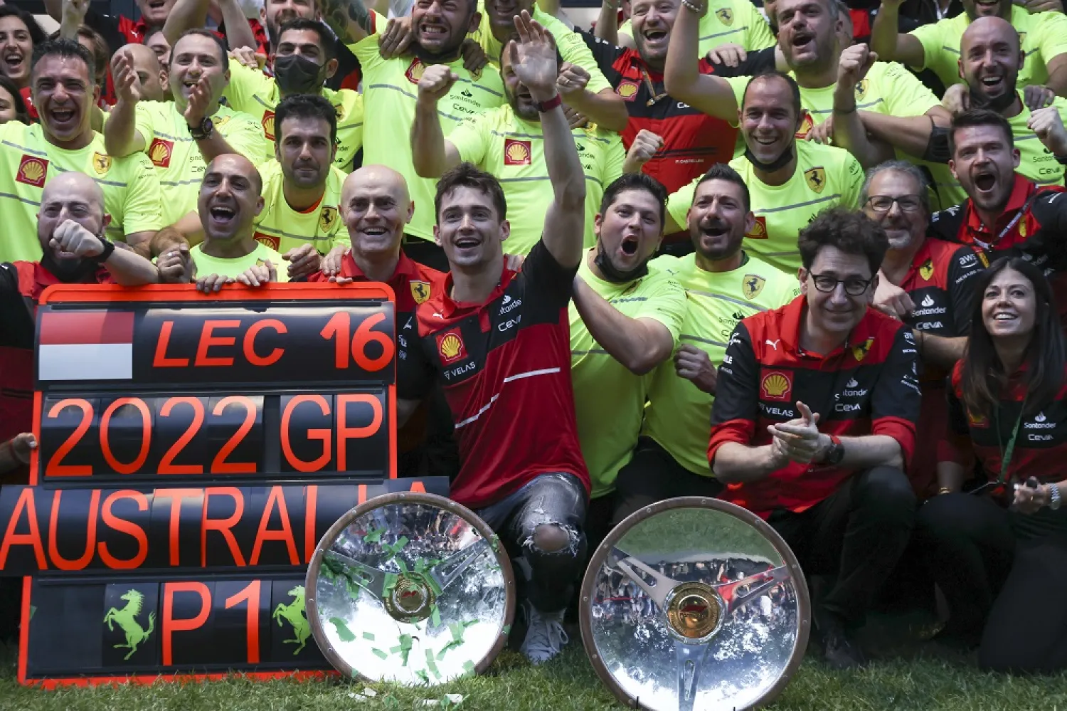 Ferrari driver Charles Leclerc, center, of Monaco celebrates with his team after winning the Australian Formula One Grand Prix in Melbourne, Australia, Sunday, April 10, 2022. (AP)