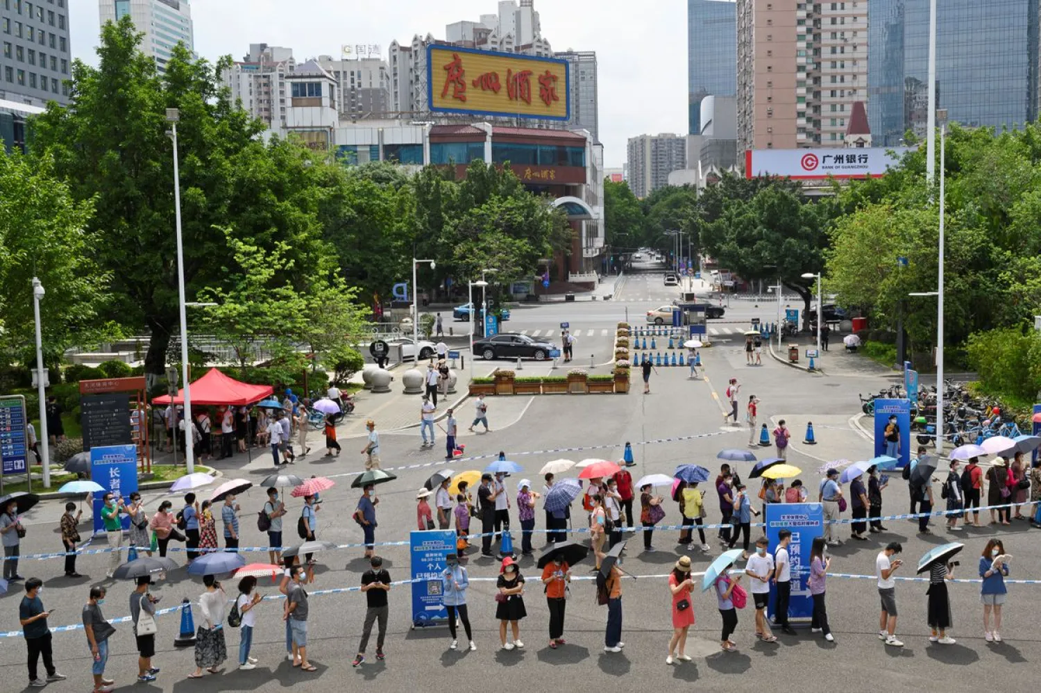 People line up to receive the coronavirus vaccine in Guangzhou. Reuters