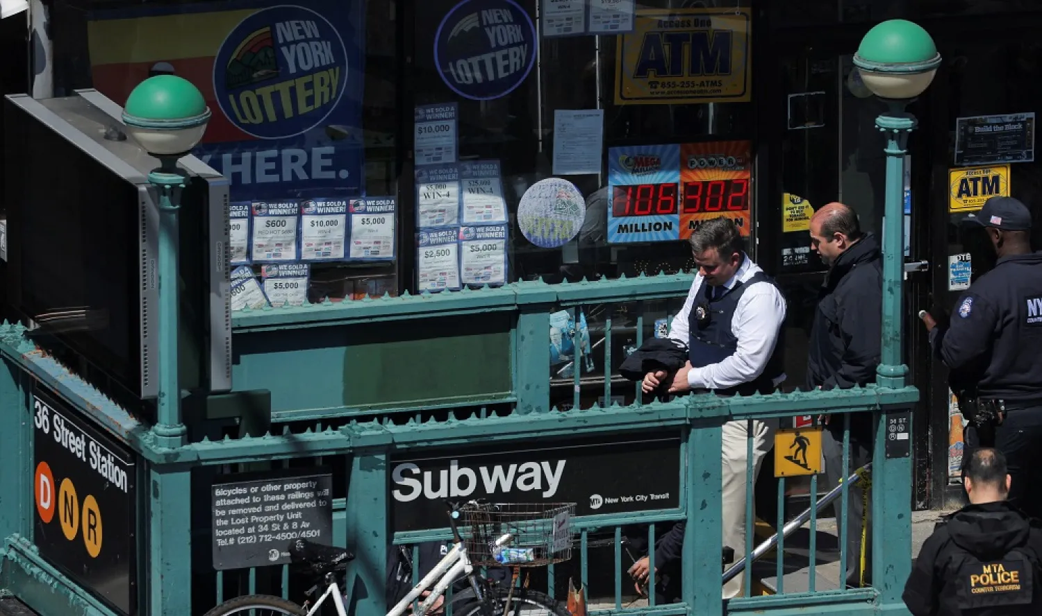 Law enforcement officers enter a subway station, the scene of a shooting, in the Brooklyn borough of New York City, New York, US, April 12, 2022. (Reuters)