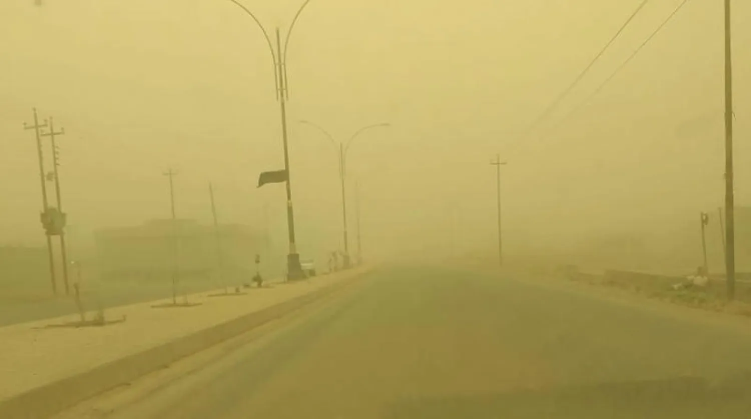 احد شوارع العاصمة بغداد خلال العاصفة الترابية (وكالة الانباء العراقية)